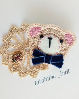 Bear brooch with blue bow